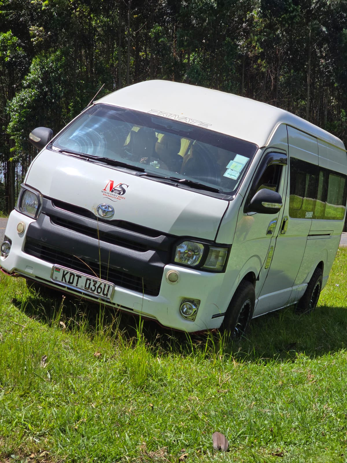 Mtemi Swift Rides van side profile parked for a road trip
